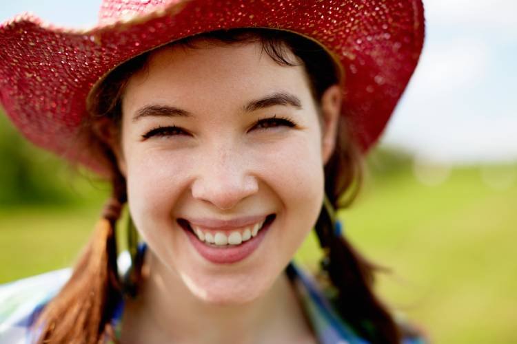 a-young-woman-in-a-pink-straw-hat-smiling-broadly-2025-04-04-08-31-38-utc.jpg