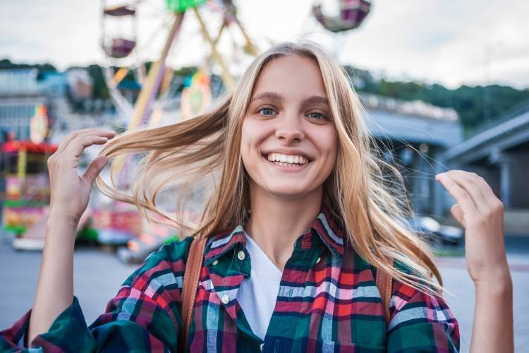 happy-blonde-girl-smiling-at-camera-while-spending-2024-11-13-14-21-28-utc.jpg